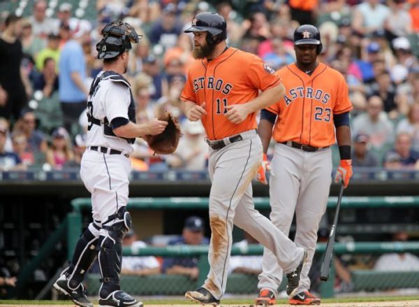 The Astros lead the AL West behind powerful bats, like those of Evan Gattis and Chris Carter, and in spite of low batting averages. (AP Photo/Duane Burleson)